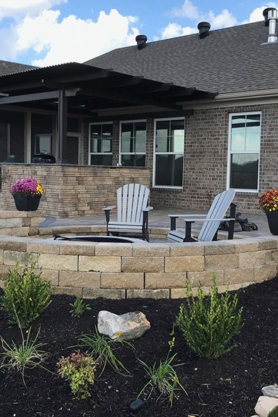 outdoor fire pit and seating area in backyard evansville in